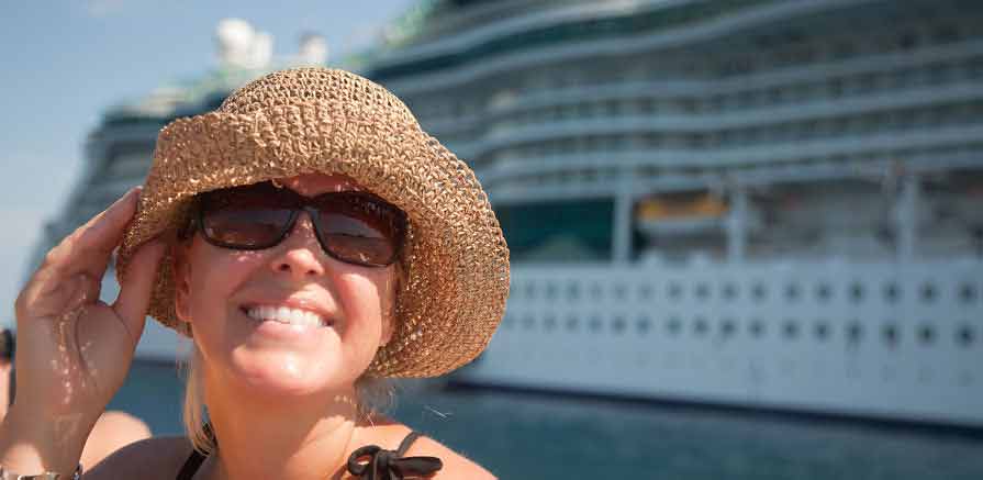 Cruise Ship Employee Poses in front of Cruise Ship Photo