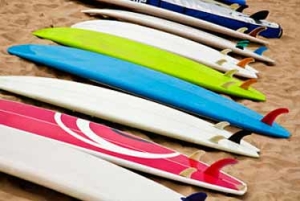 Colorful Surf School Surfboards on Beach Photo