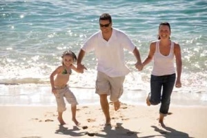 Family Plays on Beach Photo