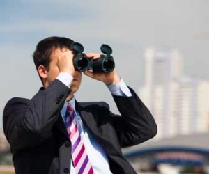 Man In Suit Searching With Binoculars Picture