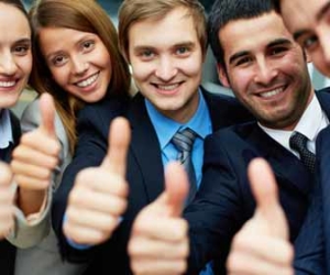 Happy Employees Giving Thumbs Up Picture
