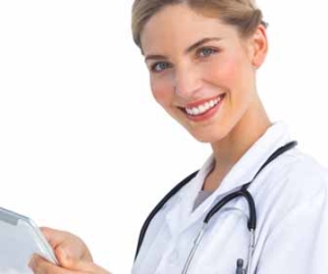 Nurse Practitioner Uses Tablet For Work