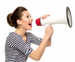 Woman speaking loudly into megaphone