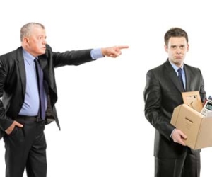 Boss firing employee with box in hands picture
