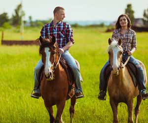 Guest Ranch Employees Riding Horses