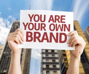 Hands holding a sign about personal branding image