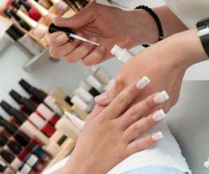 Woman Getting a Manicure at Nail Salon