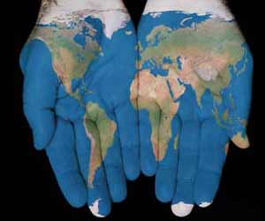 World Map Pained on Hands Image