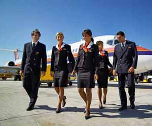 Airline Flight Attendants walking from Airplane to Terminal