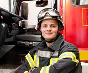 Fireman Poses by Fire Truck