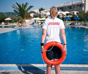 Lifeguard Watching Over Hotel Swimming Pool