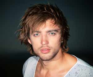 Scruffy Male Model Poses for Photo