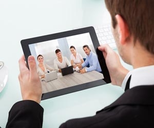 Job seeker having group video interview via tablet