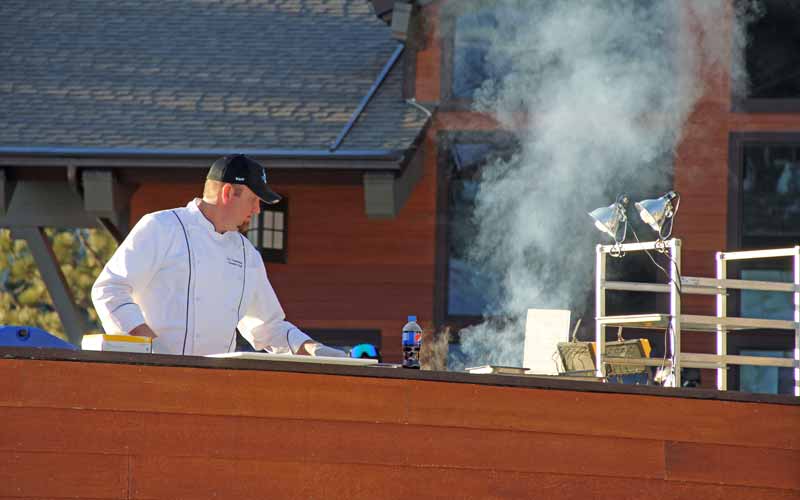 Chef at Diamond Peak Ski Resort Cooking Lunch Outside on Lodge Patio