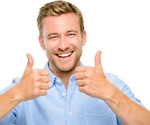 Smiling man giving two thumbs after giving a compliment