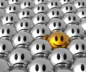 Happy gold ball stands out in crowd of unhappy silver balls