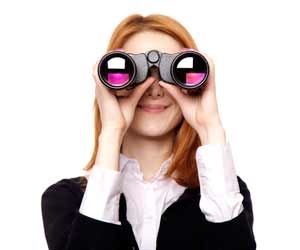 Job seekers looking at camera through binoculars
