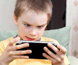 Child Playing a Video Game on a Mobile Phone