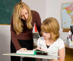 ESL Teacher Working with Student