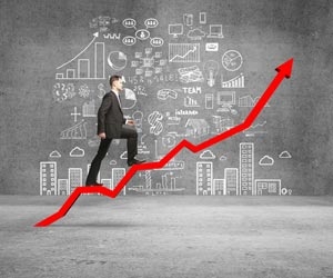 Man walking up graph showing upward business trends