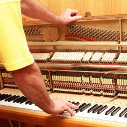Piano Tuners Adjust the Sounds a Piano Makes so that it is in the Proper Key Range