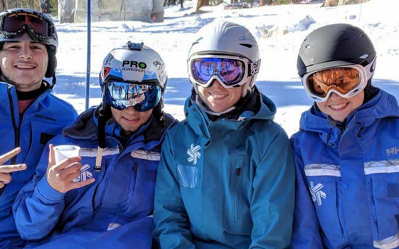 Four Ski and Snowboard Instructors on Lift
